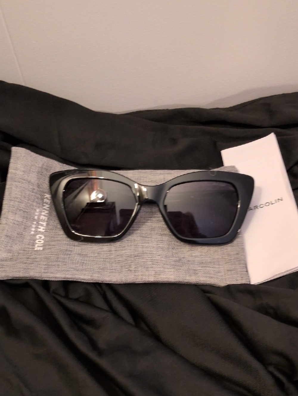Kenneth Cole Glossy Black Cat-Eye Sunglasses with Dark Lenses And Rhinestones